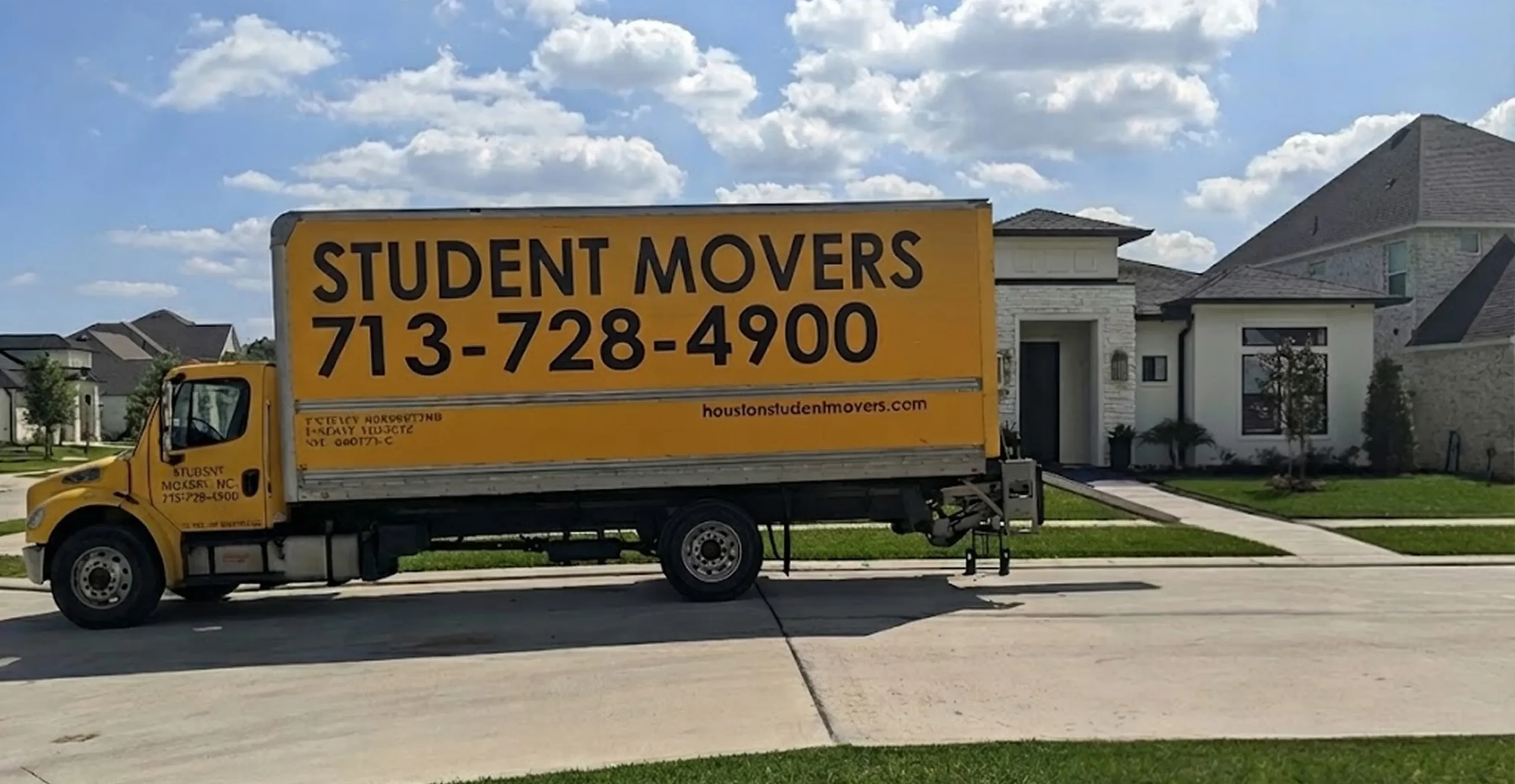 A truck parked in front of a house.